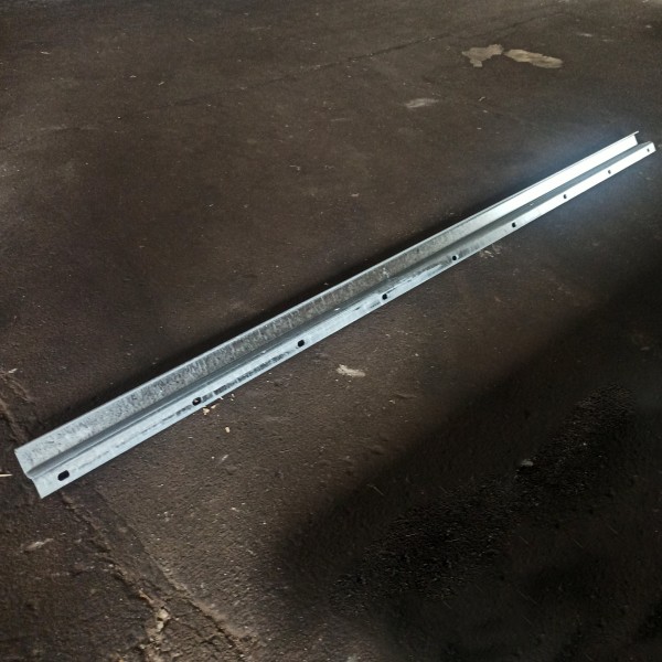 Guide rail with drill holes